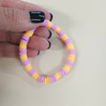 Load image into Gallery viewer, Purple and orange bracelet.