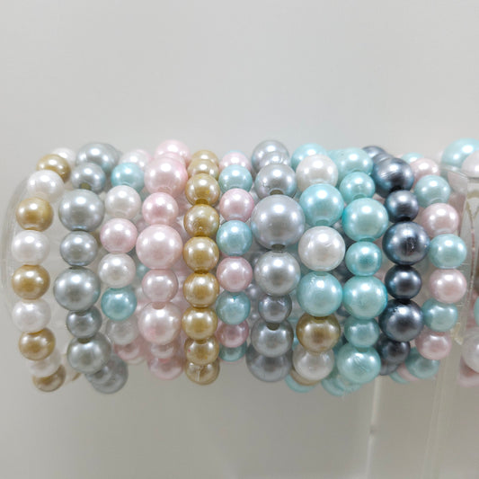 Faux pearl statement bracelets.