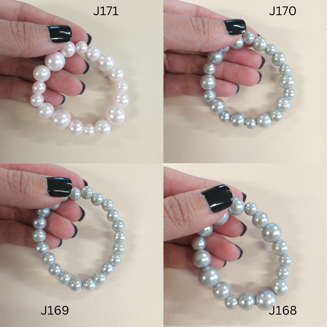 Faux pearl statement bracelets in a variety of colors.