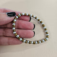 Load image into Gallery viewer, White and gold stretch bracelet.