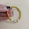 Load image into Gallery viewer, Gold hearts swiftie friendship bracelet.