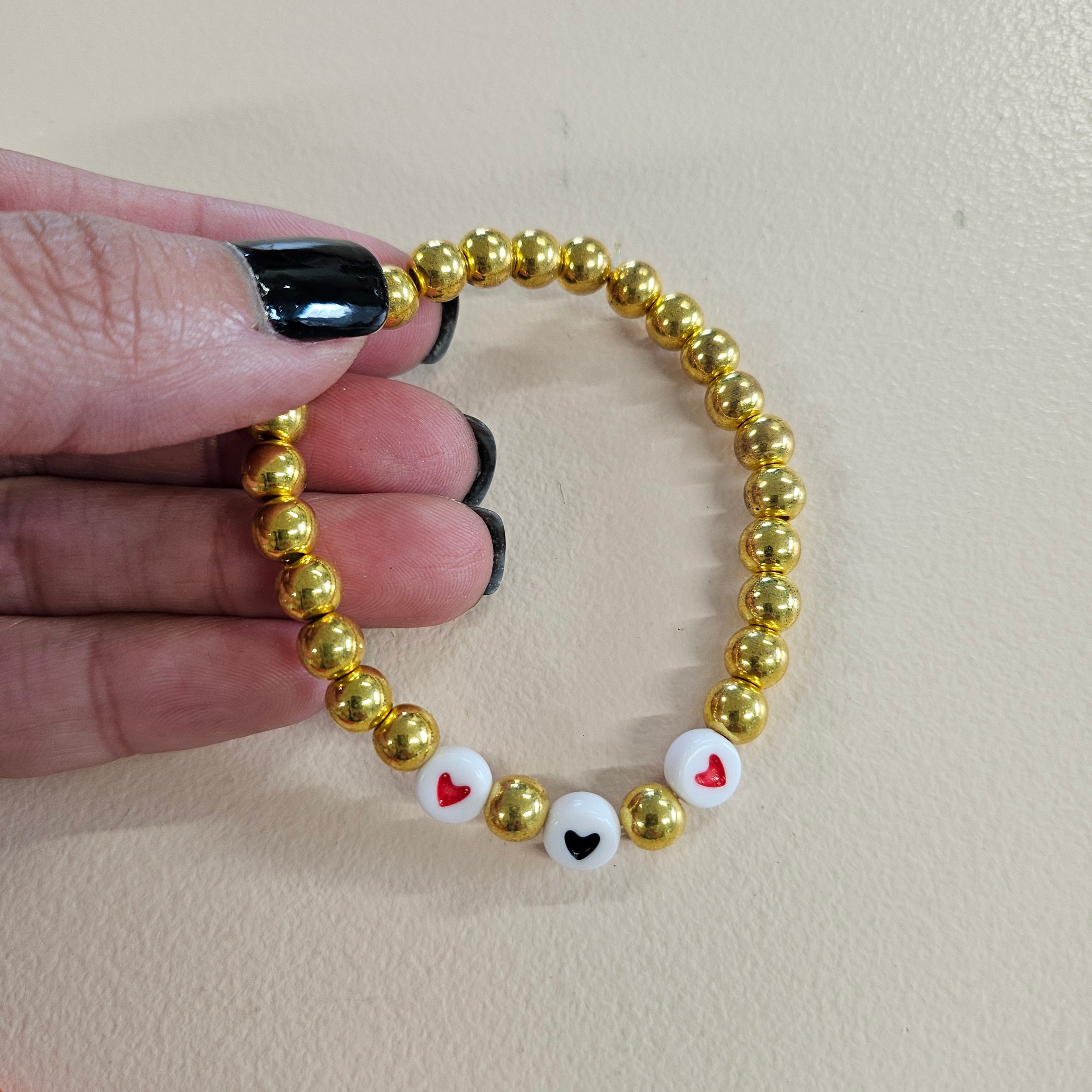 Gold hearts swiftie friendship bracelet.