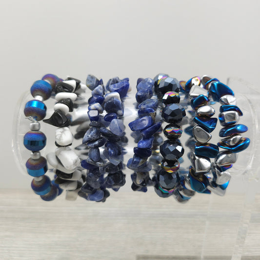 Rock stretch bracelets on stand.