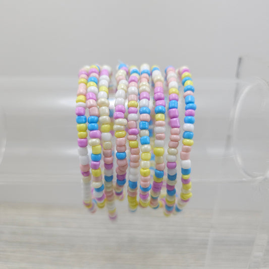 Easter themed friendship bracelets on stand.