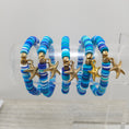 Load image into Gallery viewer, Ocean themed stretch friendship bracelets with gold starfish charm.