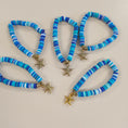 Load image into Gallery viewer, Blue friendship bracelets with gold starfish charm.