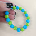 Load image into Gallery viewer, Blue and green ball bead stretch bracelet.
