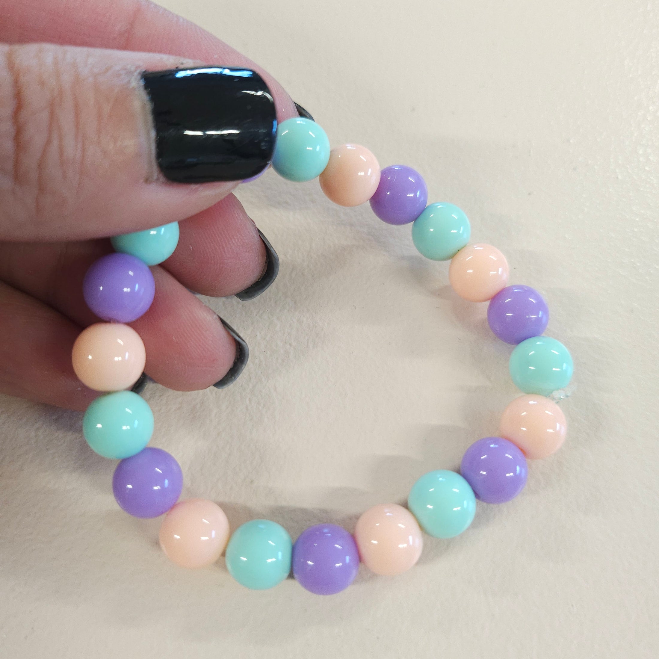 Pastel pink, green and purple ball bead stretch bracelet.