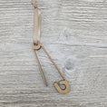 Load image into Gallery viewer, Laser cut safety pin ornament blank with ribbon.