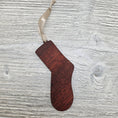 Load image into Gallery viewer, Sock ornament laser cut from exotic bloodwood.