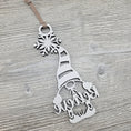 Load image into Gallery viewer, Black and white "Believe" gnome holiday ornament.
