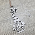 Load image into Gallery viewer, White and black "believe" gnome Christmas ornament.