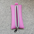 Load image into Gallery viewer, Pink pouch with a zipper on a gray textured background
