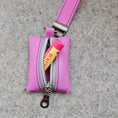 Load image into Gallery viewer, Pink pouch with a visible brand tag on a gray surface