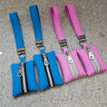 Load image into Gallery viewer, Pink and blue waist bags with zippers on a gray surface