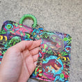 Load image into Gallery viewer, Jurassic dinosaur themed bifold wallet.