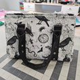 Load image into Gallery viewer, Handbag with black and white pattern on a checkered floor