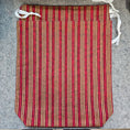 Load image into Gallery viewer, Red and beige striped mat with white straps on a gray surface