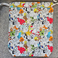 Load image into Gallery viewer, Patterned bag with cartoon character design on a gray surface