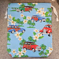 Load image into Gallery viewer, Light blue drawstring bag with white strings featuring palm trees and classic cars.