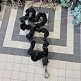 Load image into Gallery viewer, Black velvet skinny scrunchie lanyard laying on a gray cutting mat.