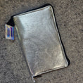 Load image into Gallery viewer, Metallic pouch on a textured surface