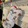 Load image into Gallery viewer, Dog holiday stocking showing dogs dressed up with Santa hats.