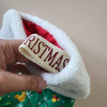Load image into Gallery viewer, Quilted disney holiday stockings with vintage merry christmas hanging ribbon.