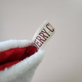 Load image into Gallery viewer, Quilted disney holiday stockings with vintage merry christmas ribbon.