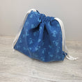 Load image into Gallery viewer, Dark blue drawstring bag to store cross stitch supplies and small projects.