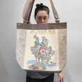 Load image into Gallery viewer, Vintage flower seed tote bag with floral and brown accents.