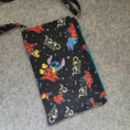 Load image into Gallery viewer, Beyond cool stitch in space cell phone purse with flap.