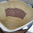 Load image into Gallery viewer, Quilted heart tote interior with light cream fabric and gray and pink slip pockets.