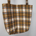 Load image into Gallery viewer, Orange, black and green plaid flannel tote bag.