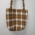 Load image into Gallery viewer, Orange, black and green soft plaid flannel tote bag.