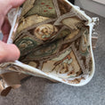 Load image into Gallery viewer, Inside of the musical lady purse with other ladies and fairies.
