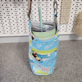 Load image into Gallery viewer, Blue and green drink carrier bag holding a thermos.