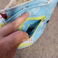 Load image into Gallery viewer, Exterior zipper pocket on the live love surf drink carrier bag.