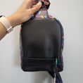 Load image into Gallery viewer, Black back of the Majestic Owl sling bag with sliding bag hardware so the bag can be worn on the left or right.