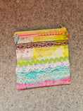 Load image into Gallery viewer, Watercolor lace zipper pouch with yellow zipper.
