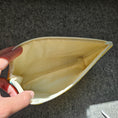 Load image into Gallery viewer, Light cream interior of bright floral zipper pouch.