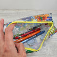 Load image into Gallery viewer, Clear vinyl boxy pouch with disney parks.