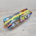 Load image into Gallery viewer, Clear vinyl pencil pouch with disney parks.