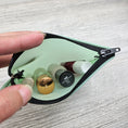 Load image into Gallery viewer, Mint green jelly vinyl zipper pouch with black zipper.