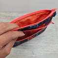 Load image into Gallery viewer, Cotton interior of the floral alien zipper pouch.