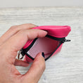 Load image into Gallery viewer, Pink mini vinyl zipper pouch for small accessories.
