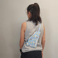 Load image into Gallery viewer, Person wearing the light blue bubble tea sling bag on their back.