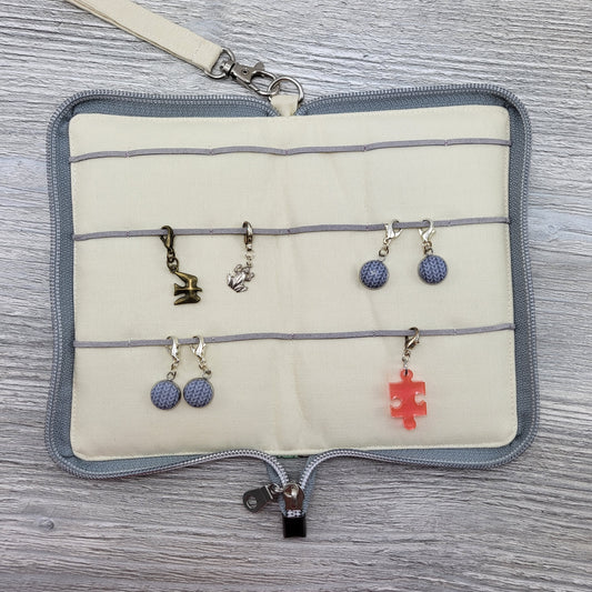 Deluxe stitch marker organizer open laid flat showing stitch markers.