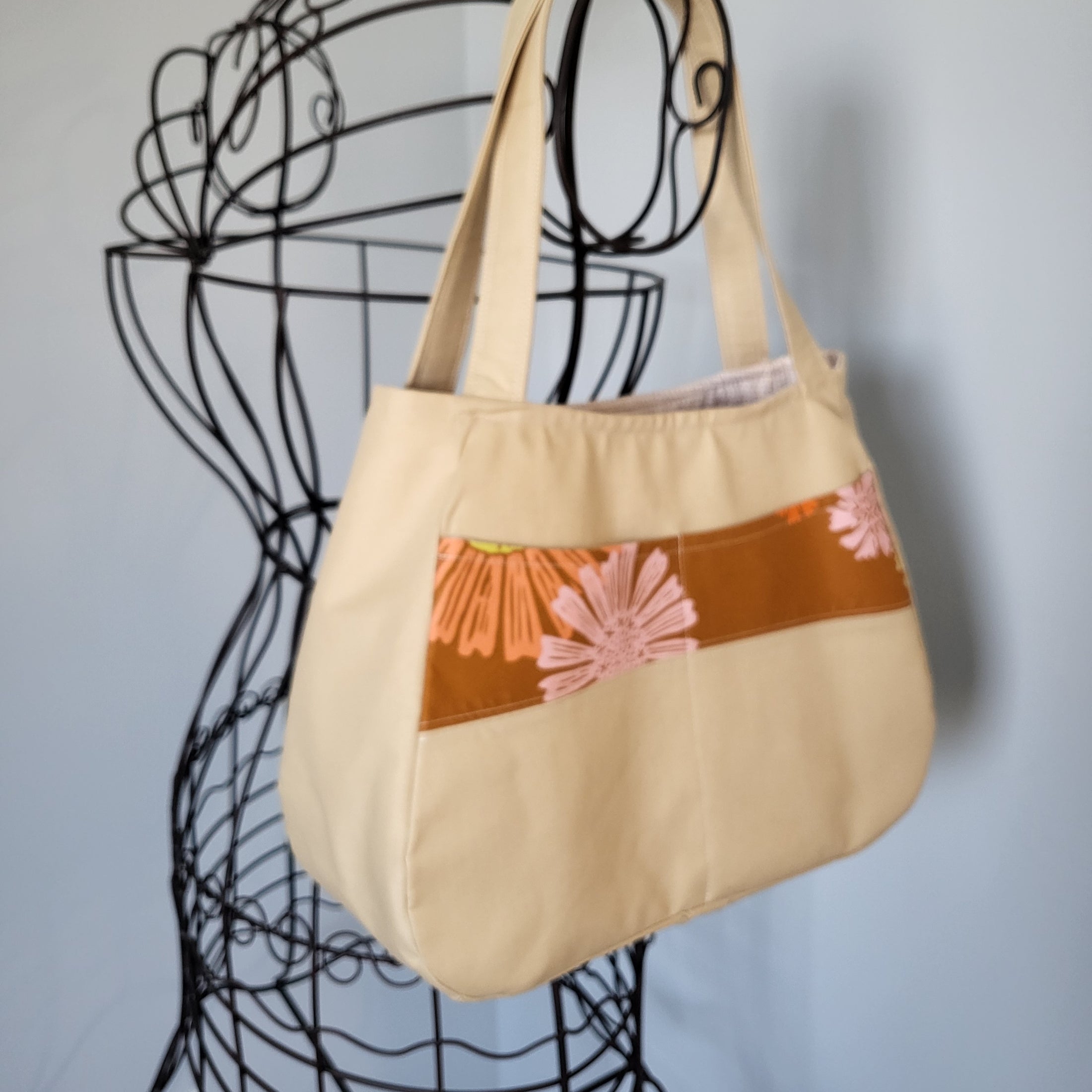 Exterior pockets of let the sunshine in tote bag.