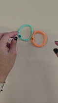 Load and play video in Gallery viewer, Video of the smiley face stretch bracelets.